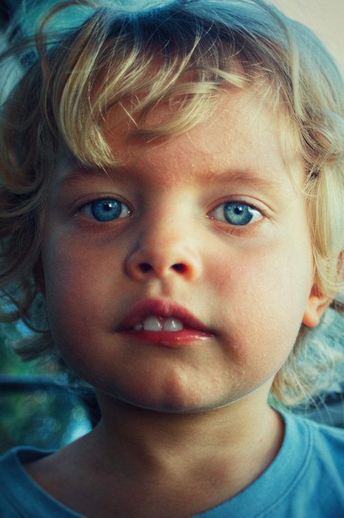 Portrait of a boy with intense blue eyes