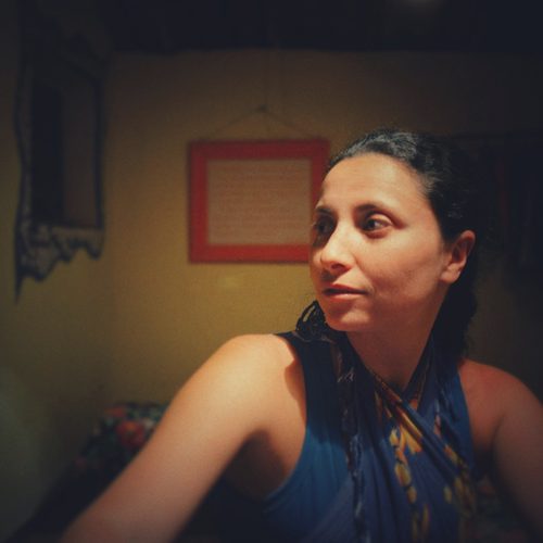 Fine art portrait of a lady in a darkened room